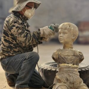 Artist Casting Bronze Child Sculpture Process Display