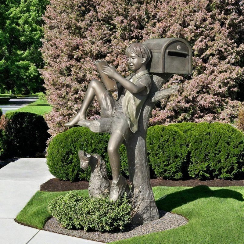 Bronze Boy Reading A Book on A Mailbox