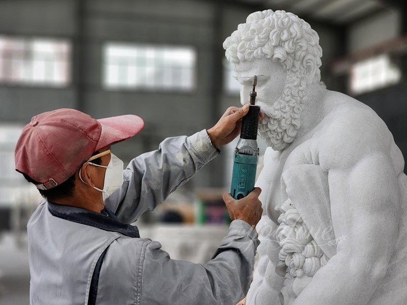 The artist is carving a marble sculpture