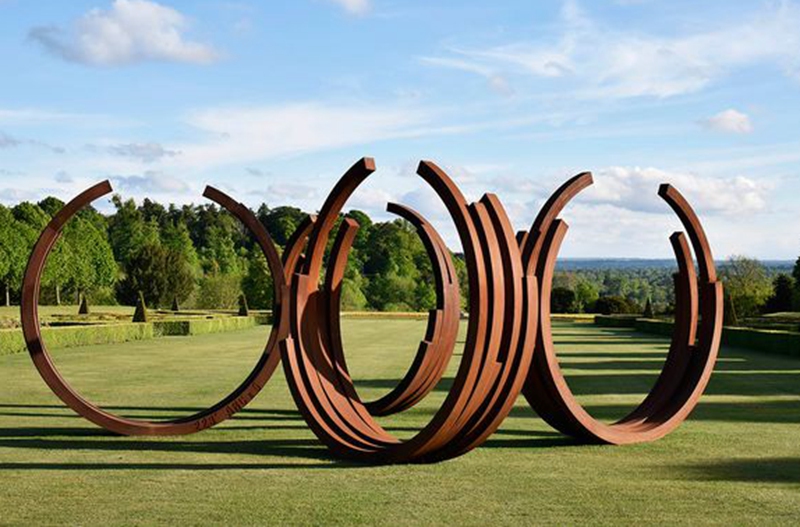 abstract half circular corten steel sculpture