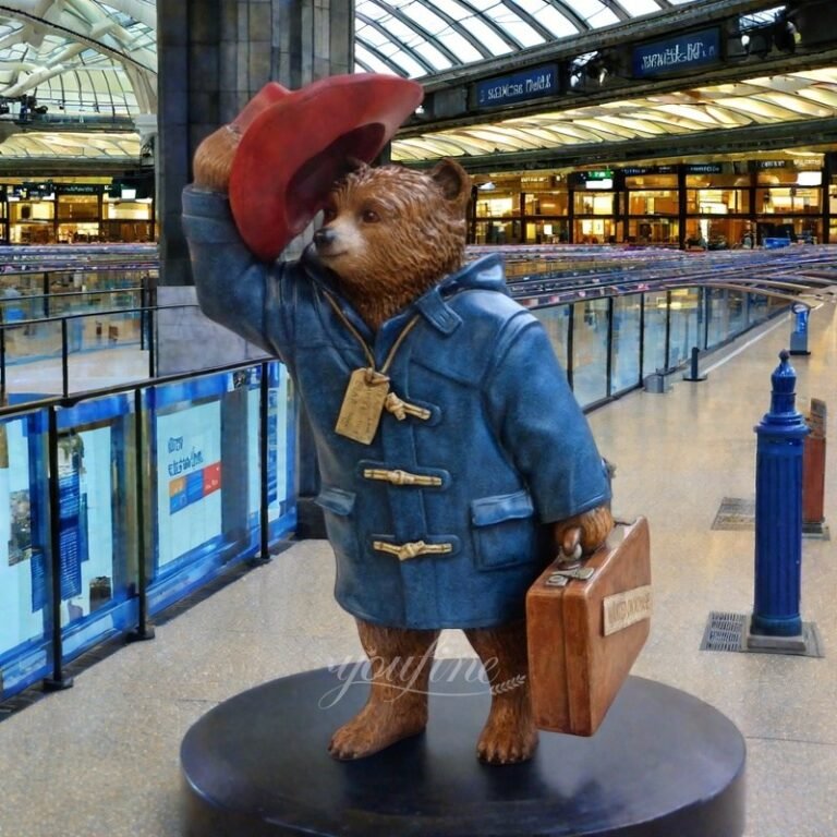 colorful bronze Paddington bear statue holding a suitcase for mall decor