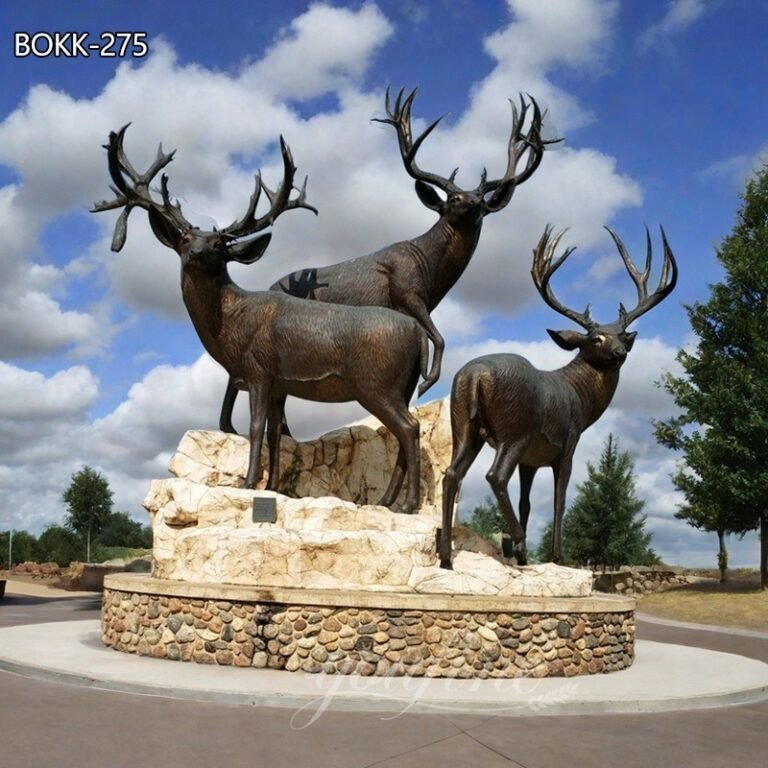 three bronze lawn deer statues