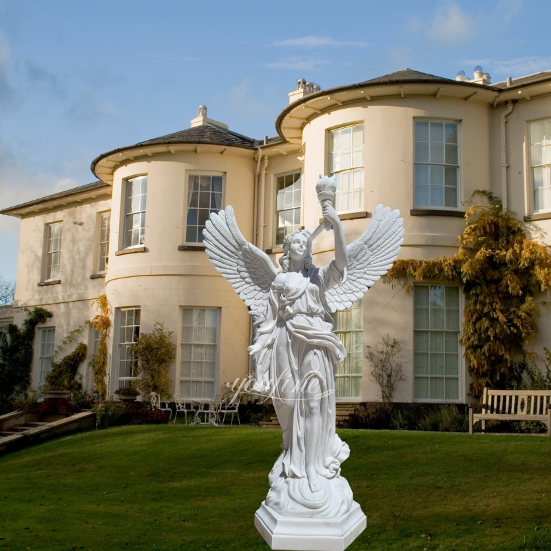 life size white marble angel sculpture with torch