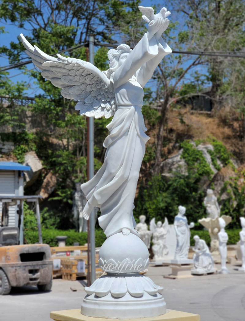 marble angel holding a bird statue