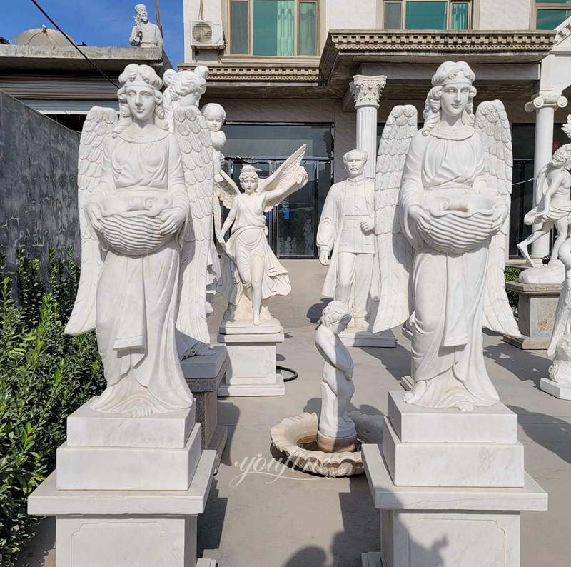 marble angels holding basins statue