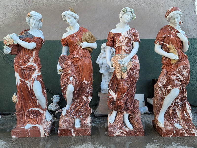 red marble four seasons statues