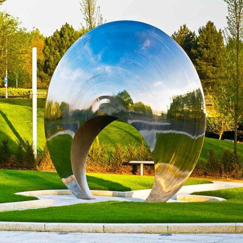 stainless steel circle sculpture in the park