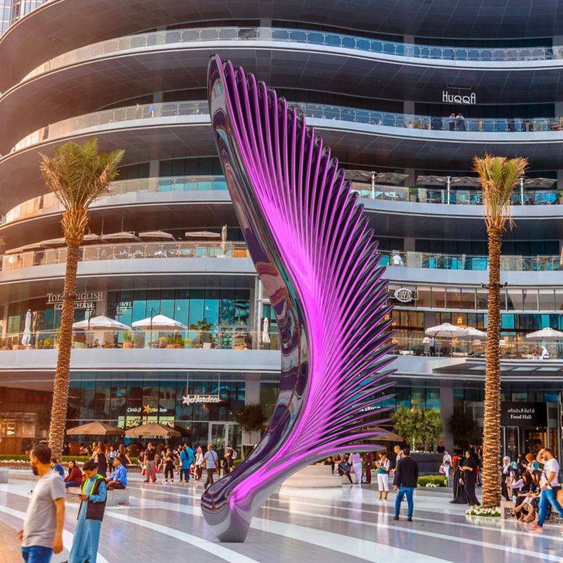 stainless steel wing sculpture in a shopping mall