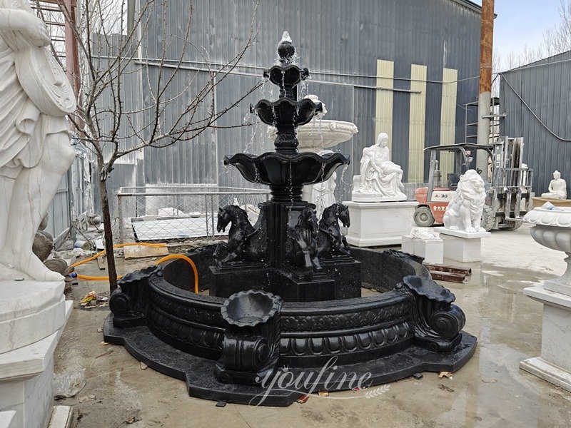 tiered black marble fountain with Pegasus horse head statue