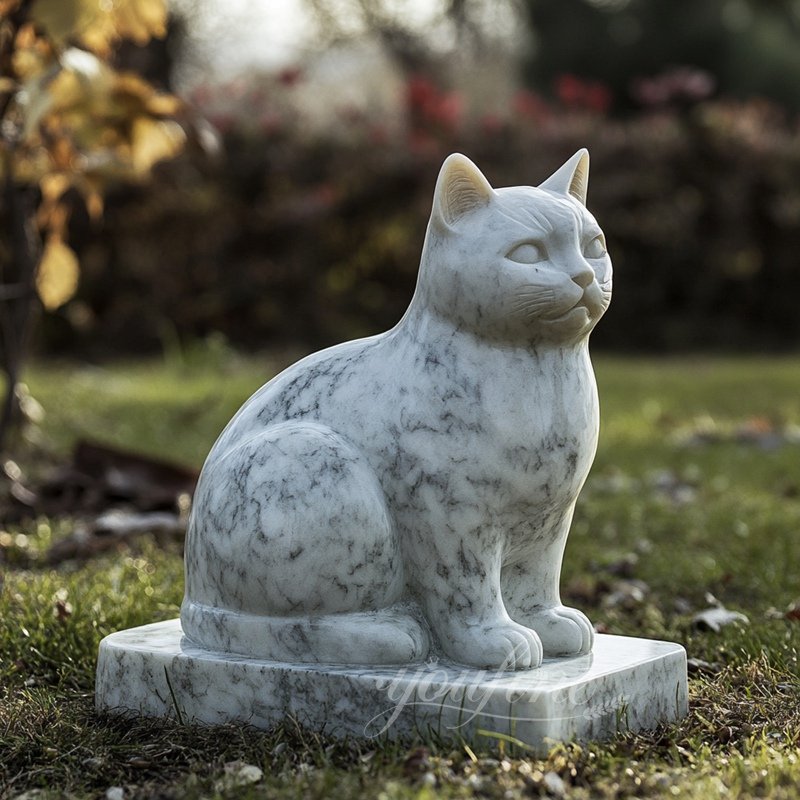 white outdoor marble cat sculpture