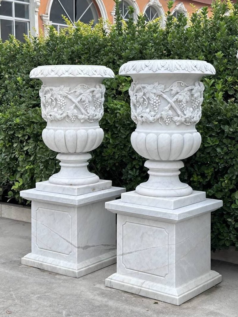 white marble flower pot with flowers