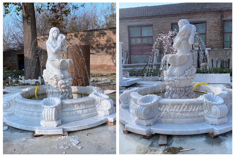 white marble woman holding a conch statue water fountain detail